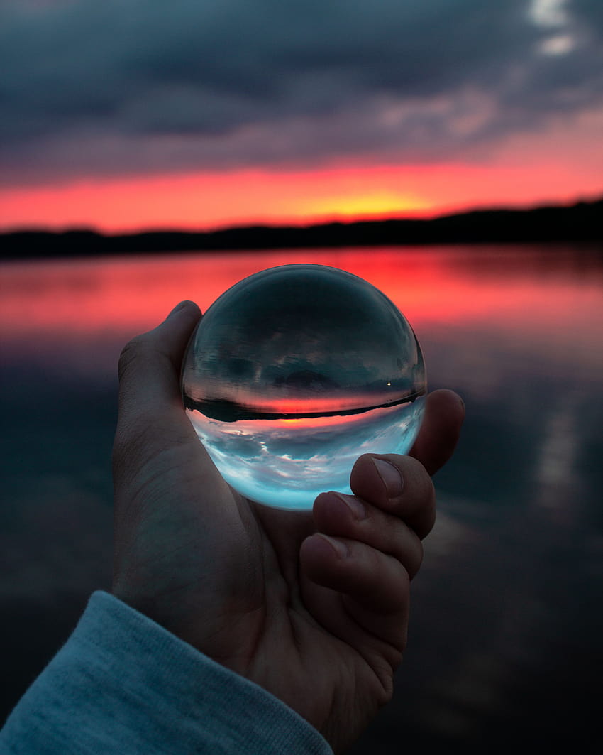 Person Holding Clear Glass Ball HD phone wallpaper
