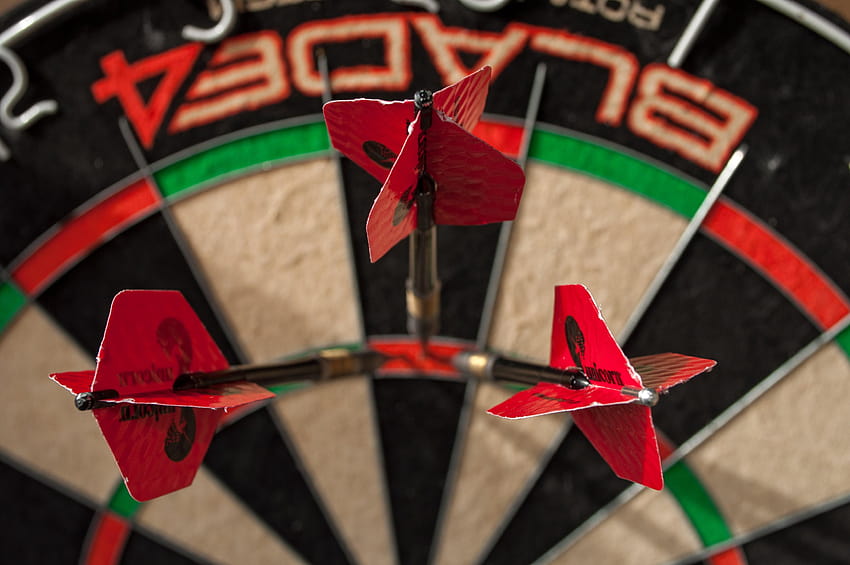 : black, green, red, and white dartboard with, hoops and darts HD wallpaper