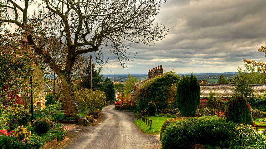 Lovely road through quaint english village HD wallpaper
