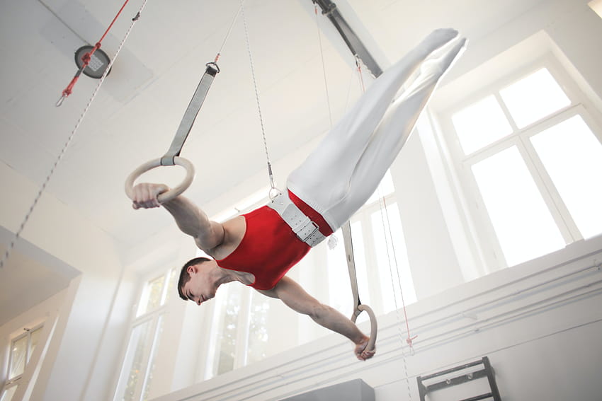of Male Gymnast Practicing on Gymnastic Rings · Stock, man gymnastics HD wallpaper
