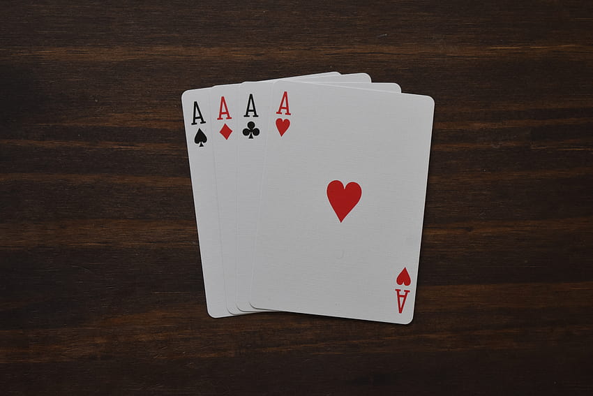 Set of playing cards on table · Stock HD wallpaper