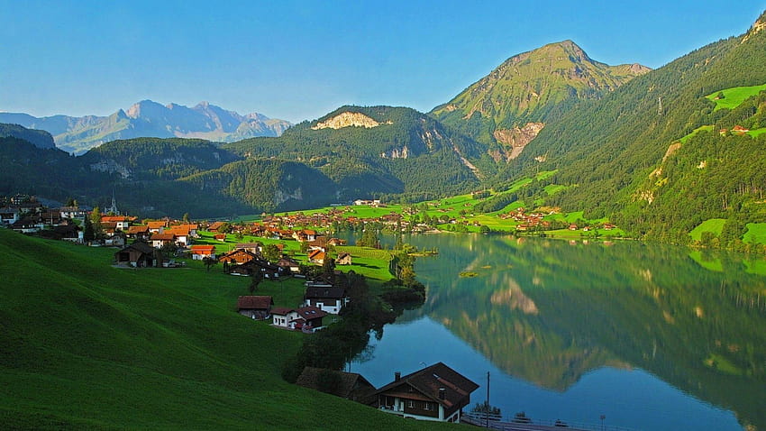 Fantastic village on an alpine lake HD wallpaper