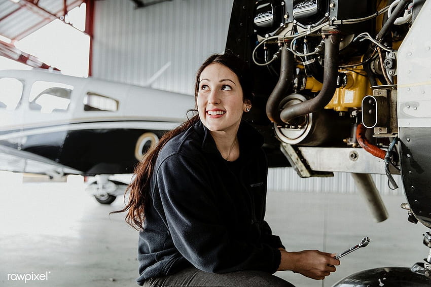 premium of Female aviation technician repairing the motor, aircraft technician HD wallpaper