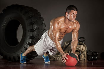 Premium Photo  Muscular man doing pushups on one hand against gym  background sport muscular and strong guy exercising muscular male doing  pushups slim man doing some push ups a the gym