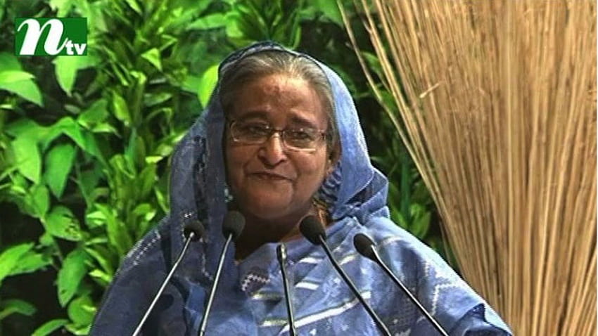 Il sari che indosso ora è fatto di iuta, ha detto il primo ministro Sheikh Hasina rivolgendosi a un prgoramme che segna il Nat Sfondo HD