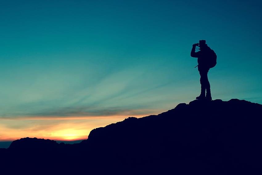 Panoramic graphy of man standing on mountain during golden, man on top of mountain HD wallpaper