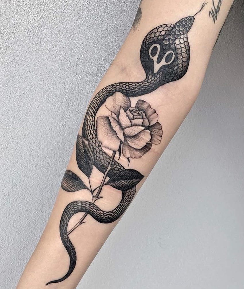 Freehand snake tattoo on the inner forearm
