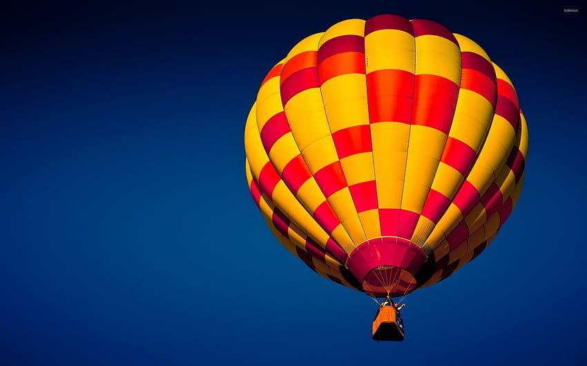 Red and yellow hot air balloon up in the air HD wallpaper