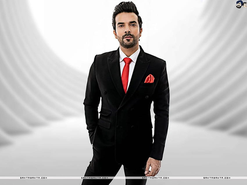 Manit Joura, ein indischer Schauspieler, sieht in einem schwarzen Anzug wie ein Gentleman aus HD-Hintergrundbild