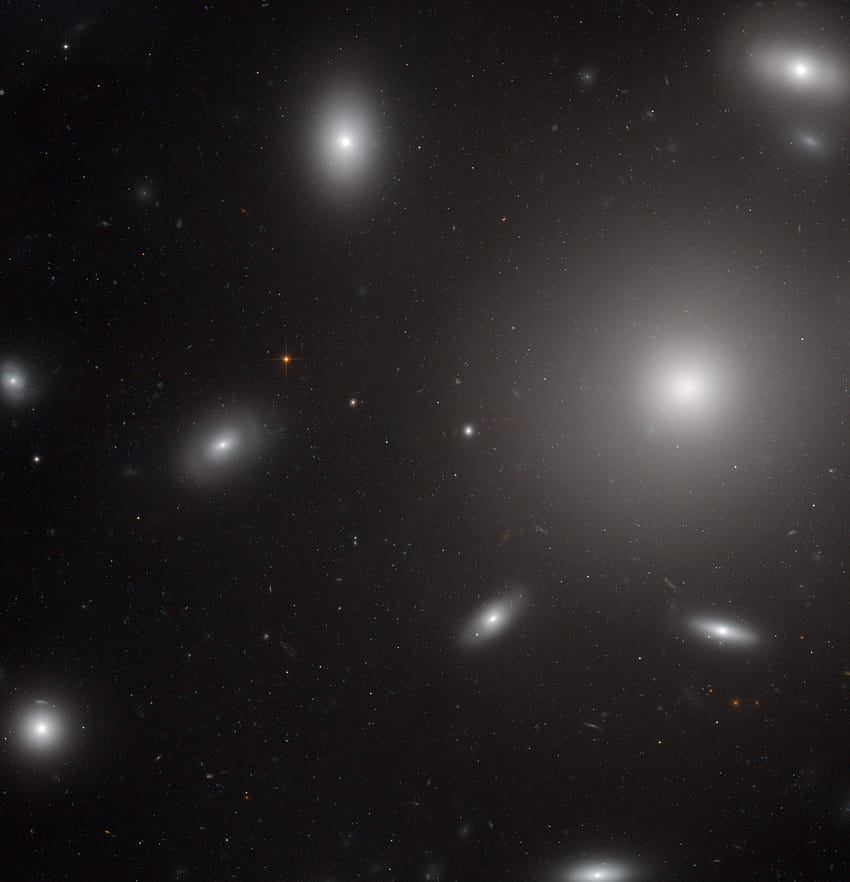 Hubble Catches Galaxies Swarmed by Star Clusters, elliptical galaxy HD phone wallpaper