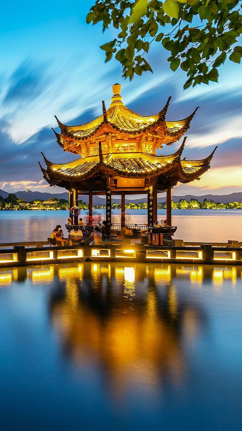 Scenic view of the West Lake, Xi lake and bridge in Hangzhou, China, on  cloudy day Stock Photo by wirestock