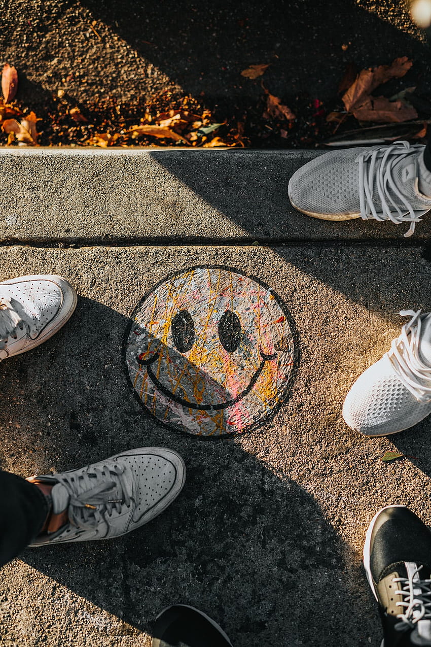 smiley paint on gray ground in front of people – Art on, people art HD phone wallpaper