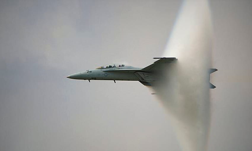 Stunning capture fighter jet as it creates a vapour cone around itself ...