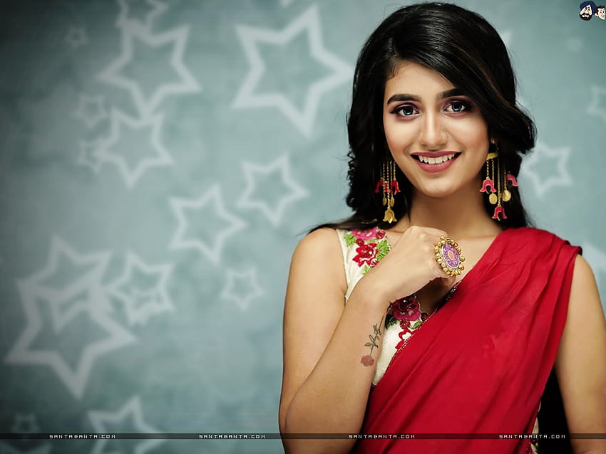 Magnetic Priya Prakash Varrier in a hot red and white saree with an elegant smile HD wallpaper