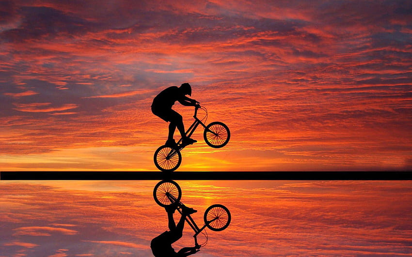 Zachód słońca na rowerze, grafika, tła, fajne akrobacje rowerowe Tapeta HD