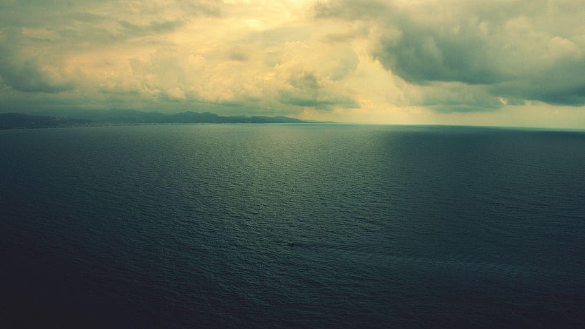 Calm sea under blue sky during daytime photo – Free Ocean Image on Unsplash