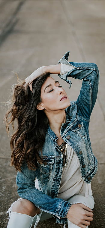 Portrait young woman wearing denim jacket and jeans - Stock Image -  F028/5711 - Science Photo Library