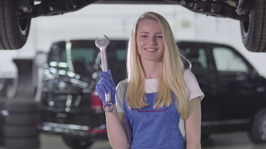 Smiling female auto mechanic in workrobe holding wrench and showing thumb up. Blond Caucasian woman looking at camera and smiling. Occupation, work, profession. Stock Video Footage 00:09 SBV, mechanic women HD wallpaper