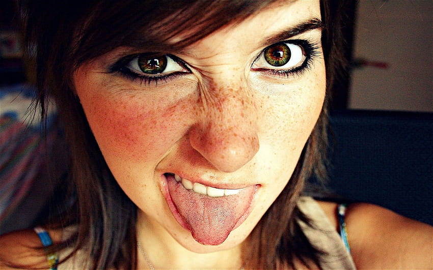Girl with freckles showing tongue 1680x1050, girl tongue HD wallpaper