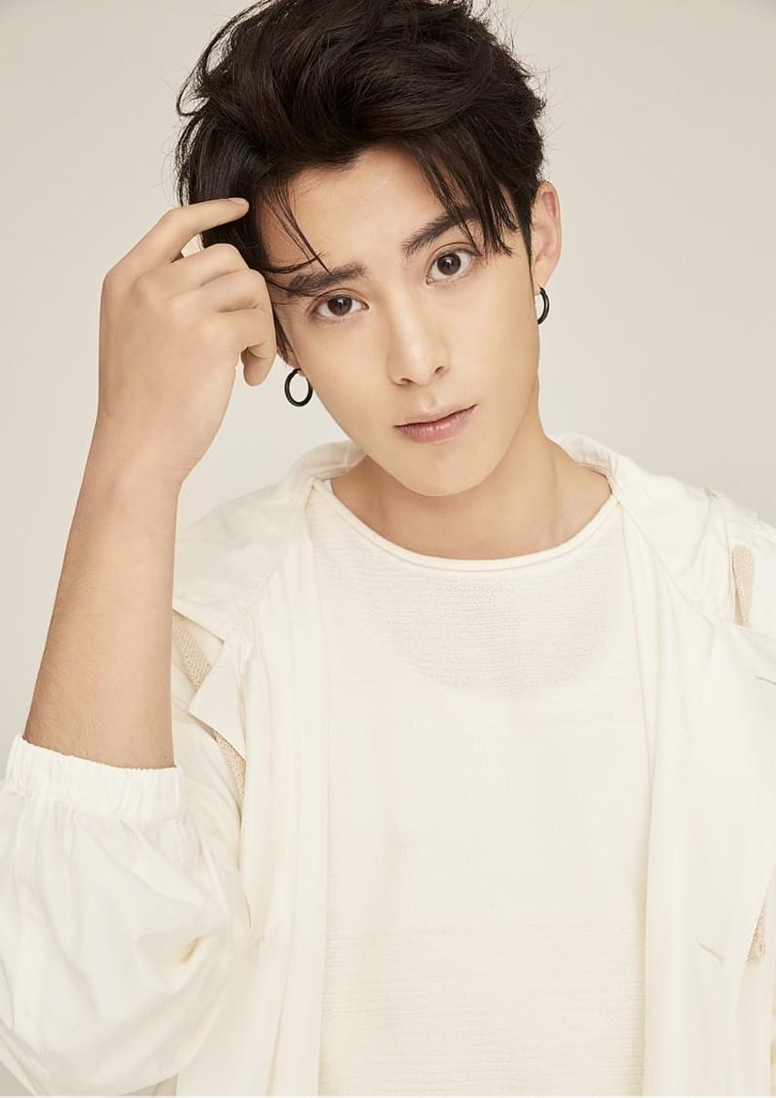 Download Dylan Wang In A Red Couch Wallpaper
