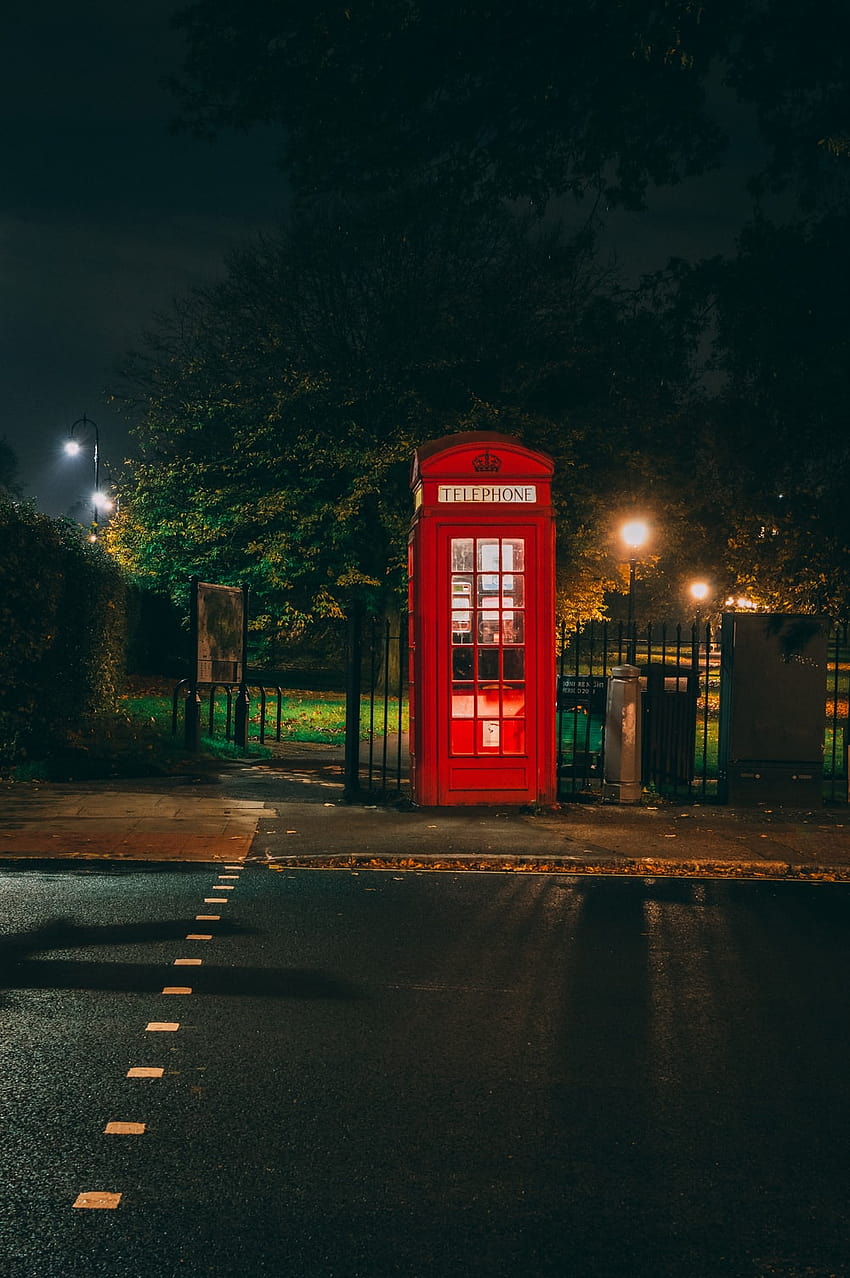 empty red telephone booth at night –, telephone box HD phone wallpaper