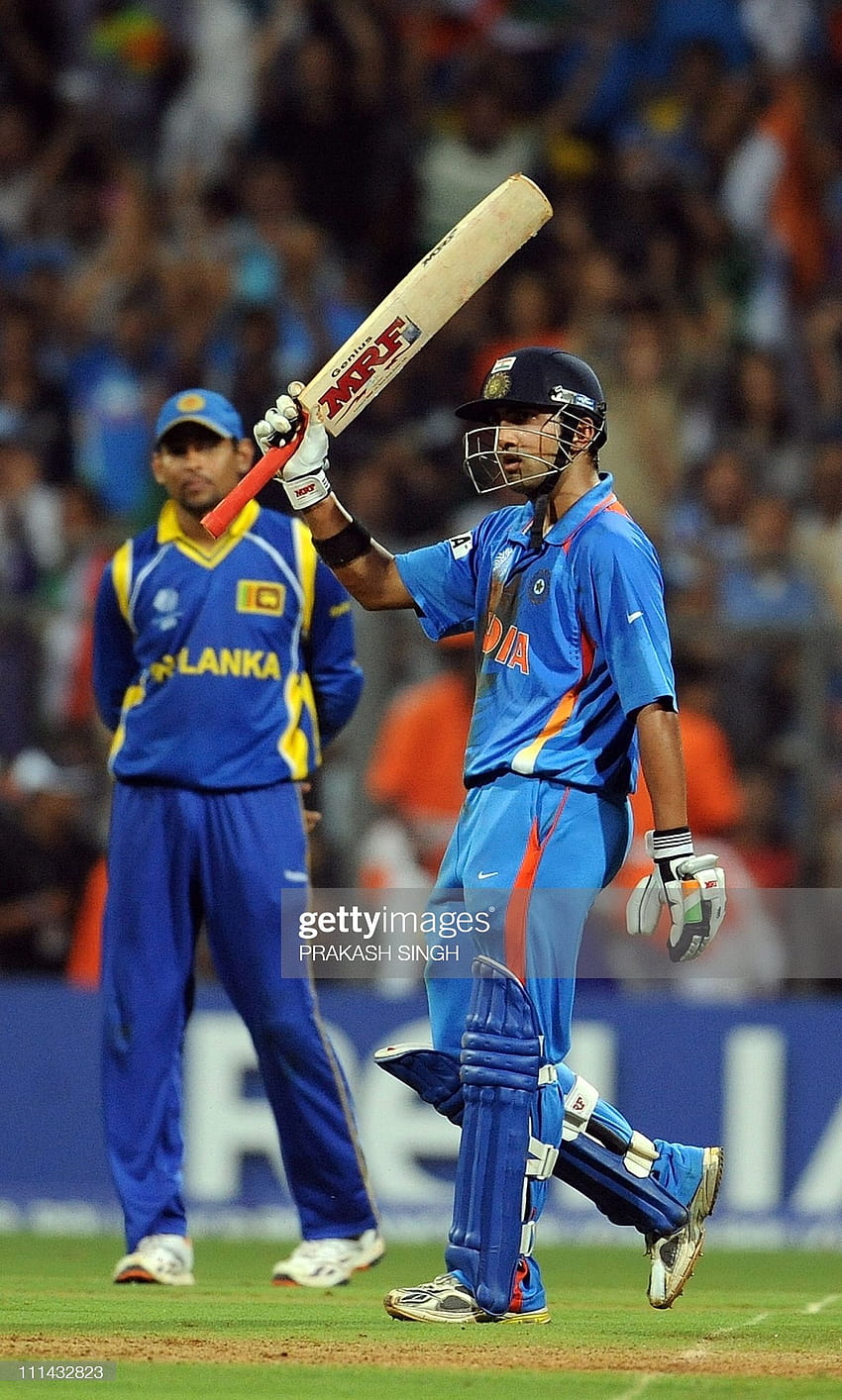 India batsman Gautam Gambhir raises his bat after scoring a half... News HD phone wallpaper