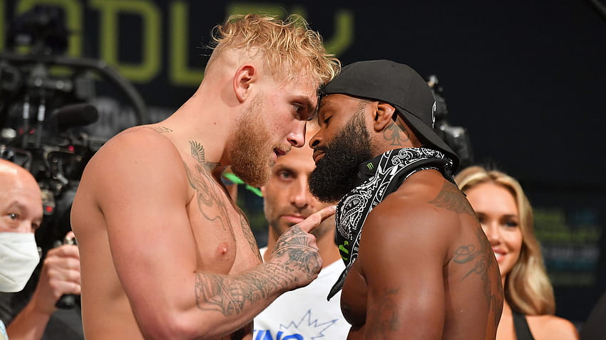 Jake Paul defeats Tyron Woodley in boxing match via split decision, hints at rematch HD wallpaper