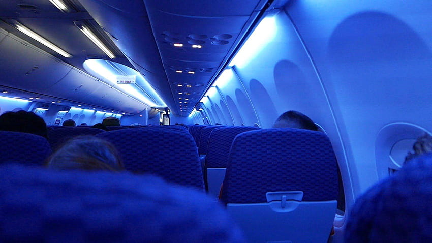 Vista interior del despegue del avión por la noche en United Airlines Boeing, cabina de avión fondo de pantalla