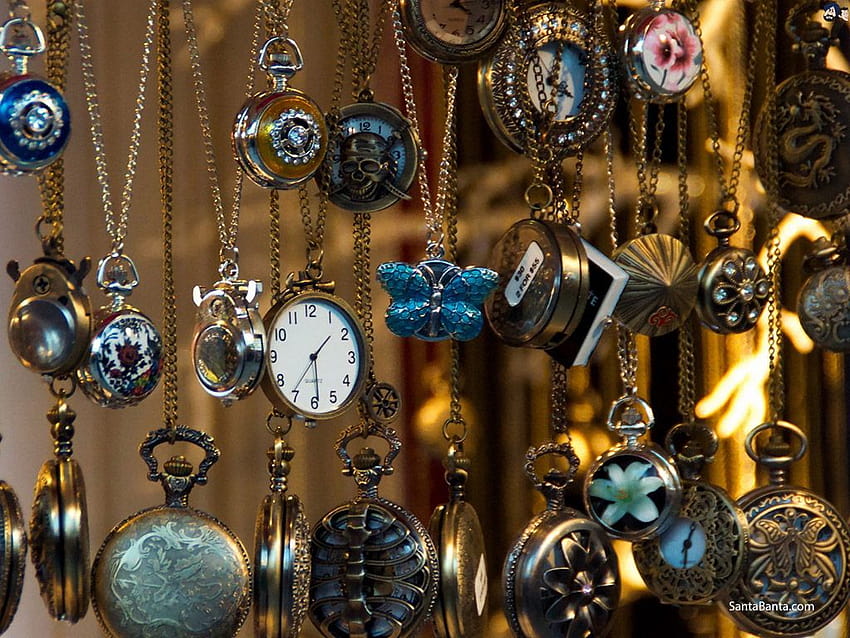 de relojes de bolsillo clásicos en una tienda de antigüedades fondo de pantalla