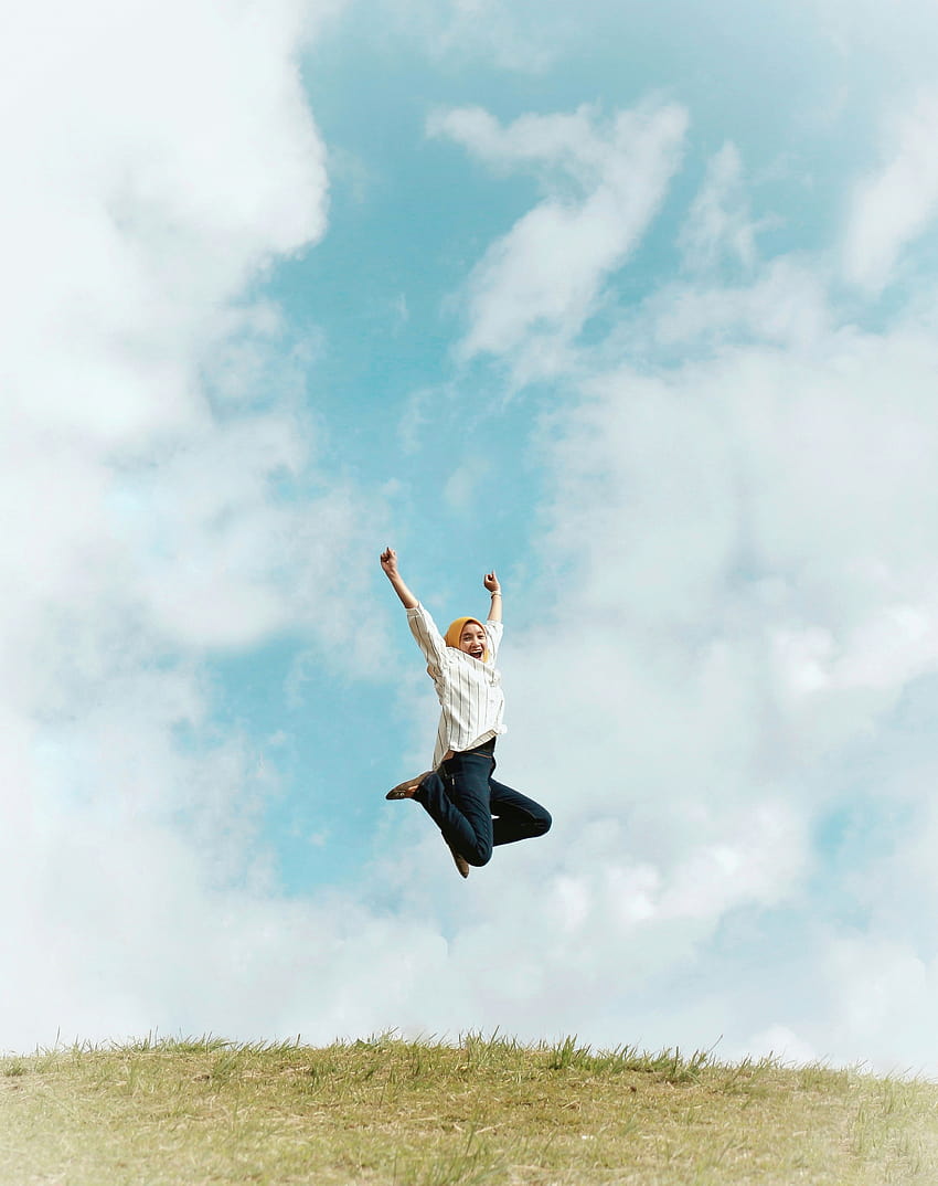 Person Jumping On Air With Clouds Backgrounds · Stock HD phone wallpaper
