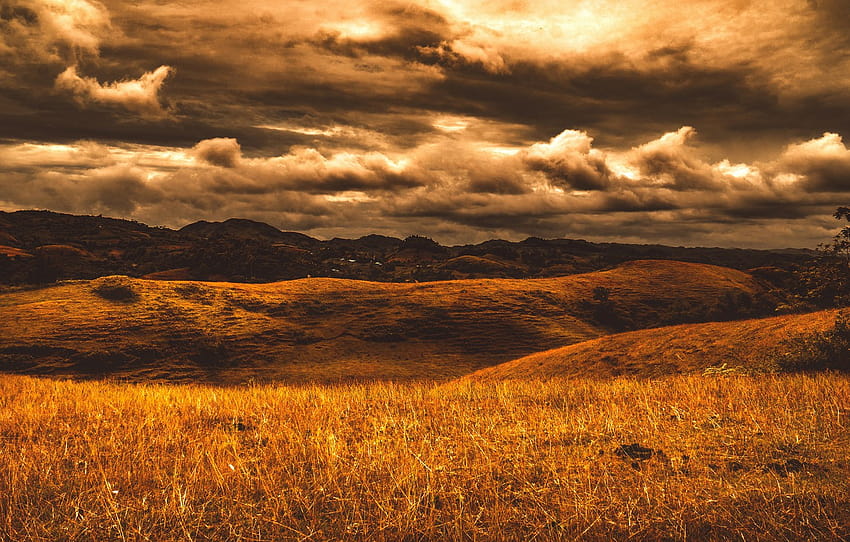 field, autumn, the sky, clouds, light, sunset, mountains, clouds, hills, dal, village, dry grass, gloomy sky , section пейзажи HD wallpaper