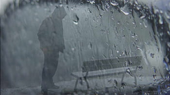 Bức hình chàng trai trong mưa sẽ đốn tim bạn bởi vẻ đẹp cuốn hút của nó. Cùng dõi theo những vạt áo mưa trôi dịu dàng, chiêm ngưỡng sự tình tứ trong từng cử chỉ của chàng trai này.