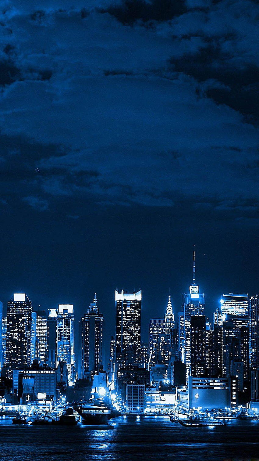 Skyline nocturno de la gran ciudad de Metropolis fondo de pantalla del teléfono