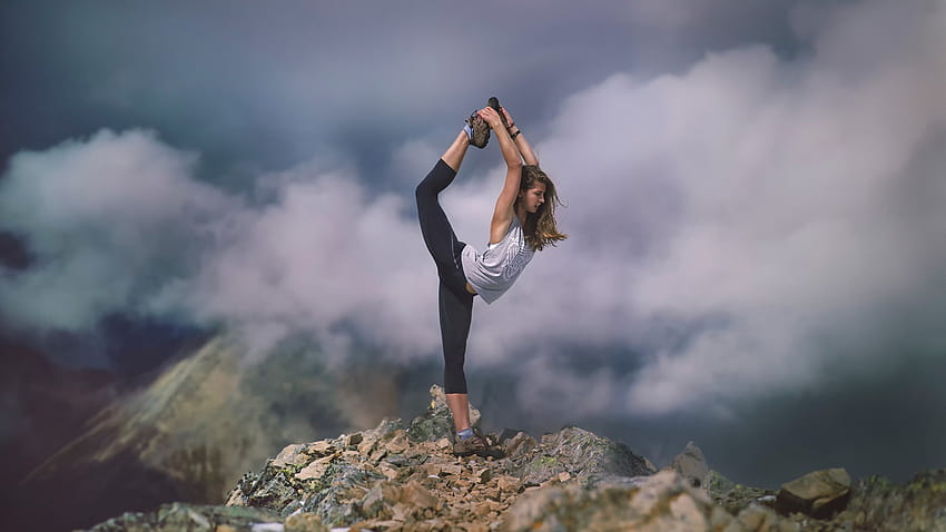 : sports, sunlight, mountains, women outdoors, model, depth of field, long hair, rock, nature, brunette, bare shoulders, open mouth, jumping, clouds, mist, yoga, tights, legs up, hiking, stretching, cloud, mountain, adventure, women hiking HD wallpaper