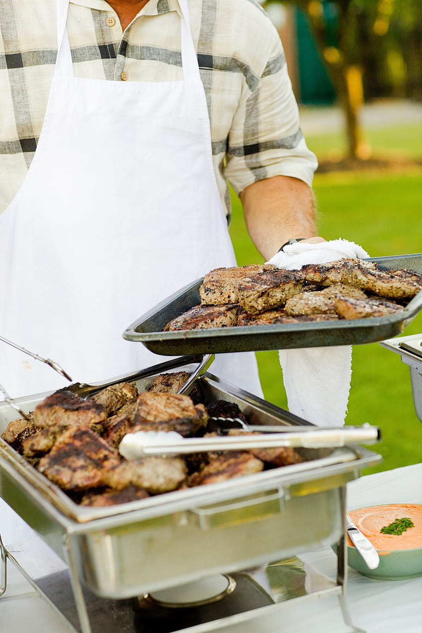 ID: 208508 / a man wearing a white apron setting up a catering table of bbq food, cooking meat HD phone wallpaper