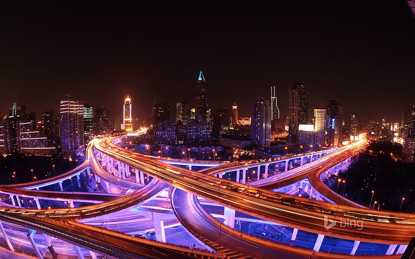 Shanghai's roadways and skyline lit up at night HD wallpaper