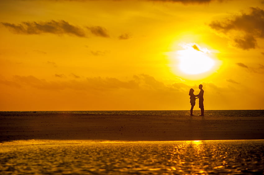 Man and Woman Standing Near Seashore Under Sunset, under the sunset HD wallpaper