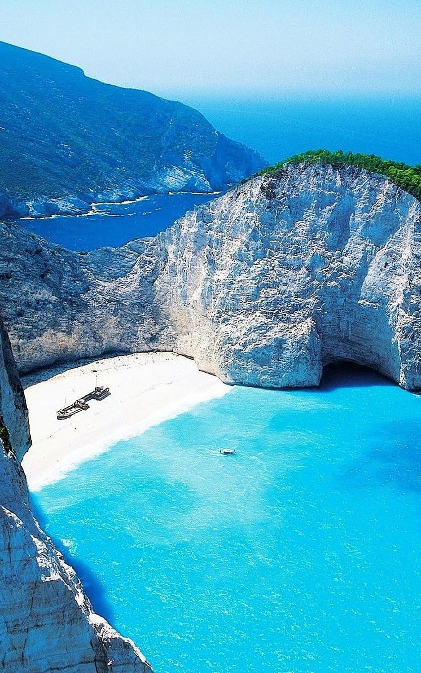 Premium Photo | Navagio beach or shipwreck bay with turquoise water and  pebble white beach famous landmark location landscape of zakynthos island  greece