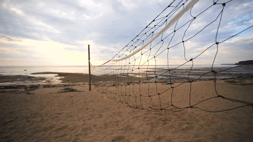A closeup of volleyball court divider net on the beach. Stock Video, volleyball court backgrounds HD wallpaper