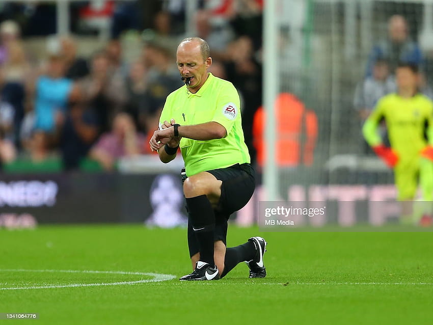 the referee, Mike Dean, takes a knee during the Premier League match... News HD wallpaper