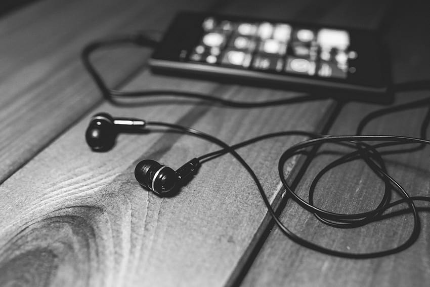 Black earphones on a desk · Stock, earbuds HD wallpaper